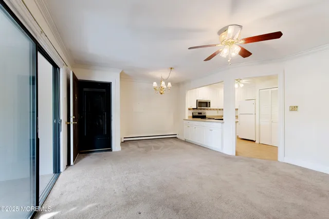 a view of a kitchen with an empty space and a kitchen