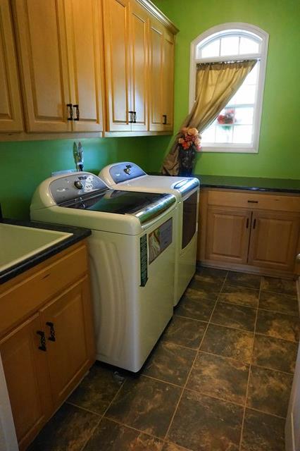 37 Copper Road Seale, AL 36875 - Photo 13 of 42 a kitchen with a sink cabinets and a window
