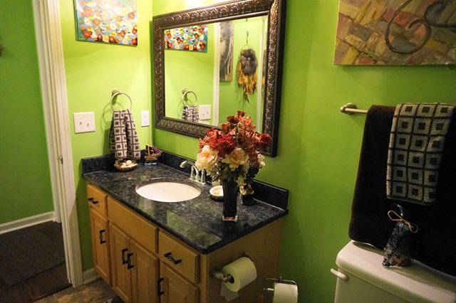 37 Copper Road Seale, AL 36875 - Photo 16 of 42 a bathroom with a granite countertop sink and a mirror