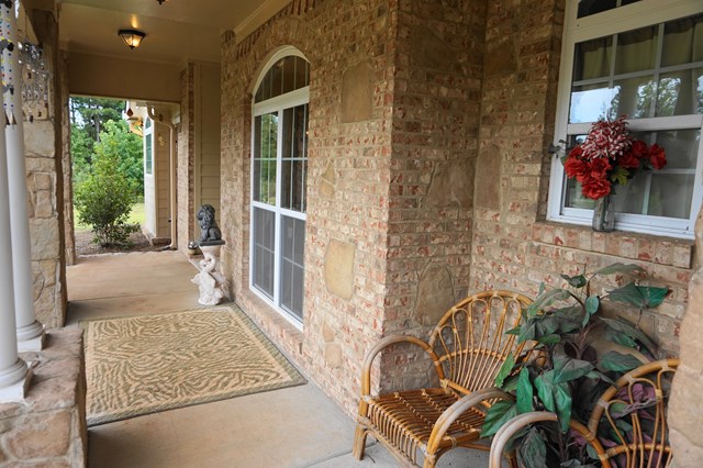 37 Copper Road Seale, AL 36875 - Photo 2 of 42 a view of a porch with chairs and front door