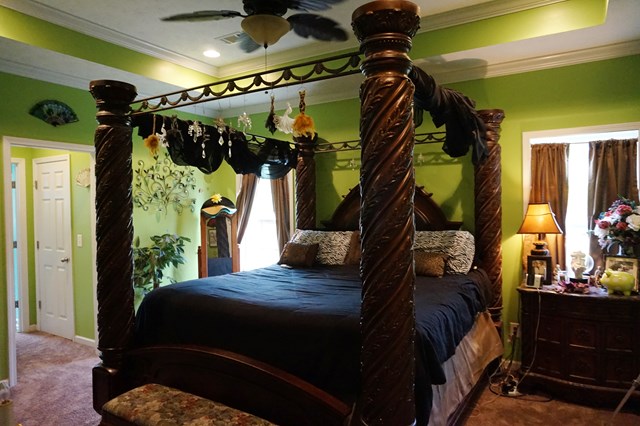 37 Copper Road Seale, AL 36875 - Photo 26 of 42 a bedroom with a bed and a mirror