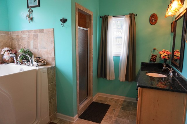 37 Copper Road Seale, AL 36875 - Photo 31 of 42 a bathroom with a refrigerator and a sink