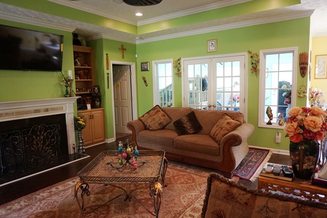 37 Copper Road Seale, AL 36875 - Photo 8 of 42 a living room with furniture a flat screen tv and a fireplace
