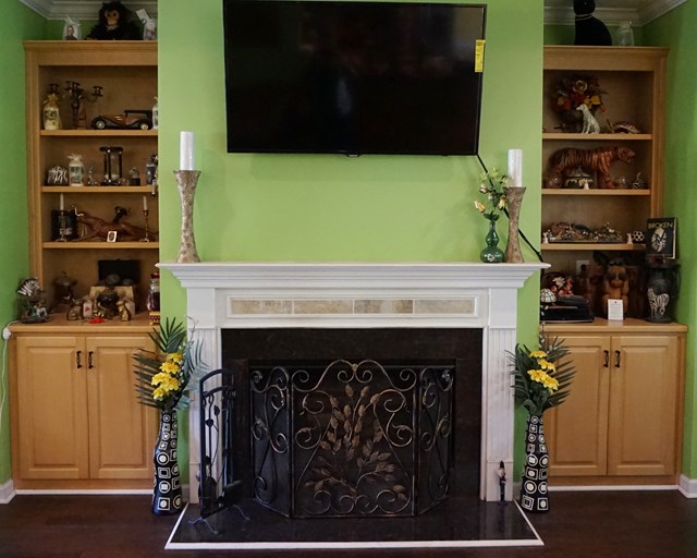 37 Copper Road Seale, AL 36875 - Photo 9 of 42 a living room with a fireplace and a wooden floor