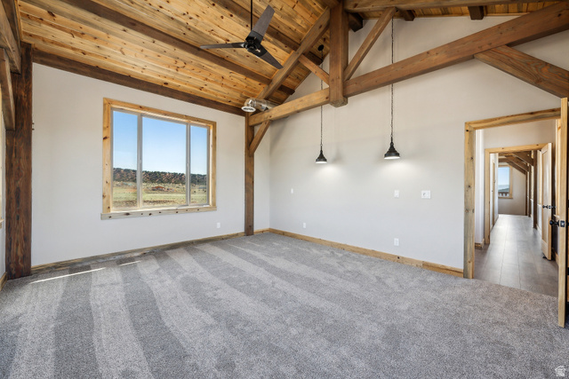 46997 West Thunder Road Fruitland, UT 84027 - Photo 31 of 49 Spare room featuring a wood ceiling with exposed beams, a ceiling fan, carpet flooring, and high vaulted ceiling