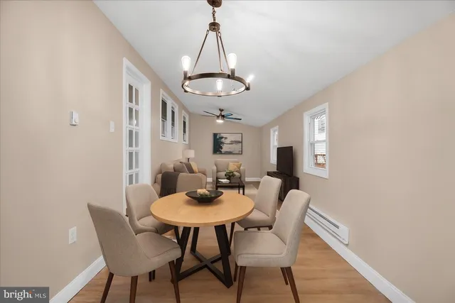 a dining room with furniture and window