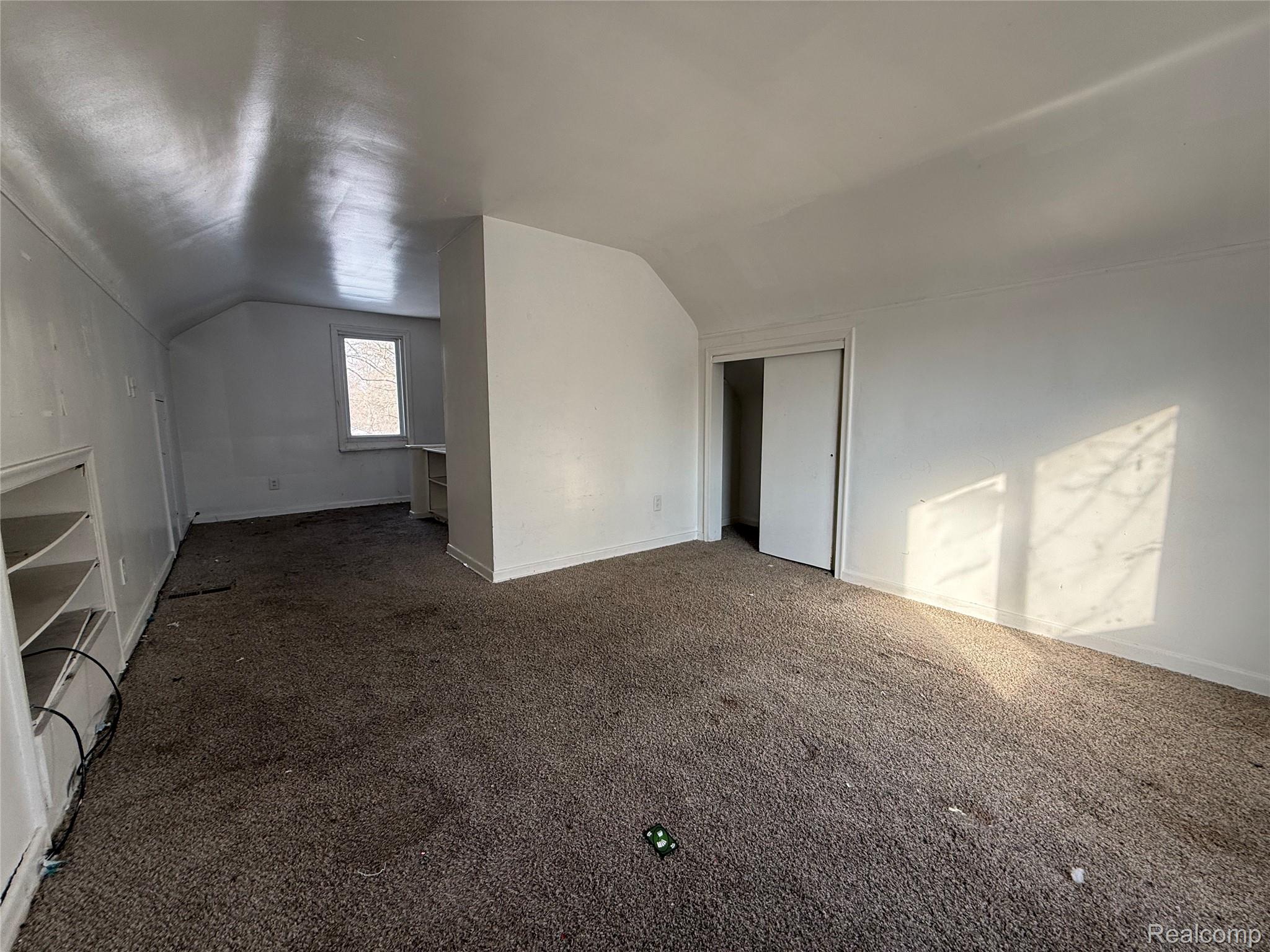 8864 Heyden Detroit, MI 48228 - Photo 11 of 16 Bonus room featuring carpet flooring and lofted ceiling