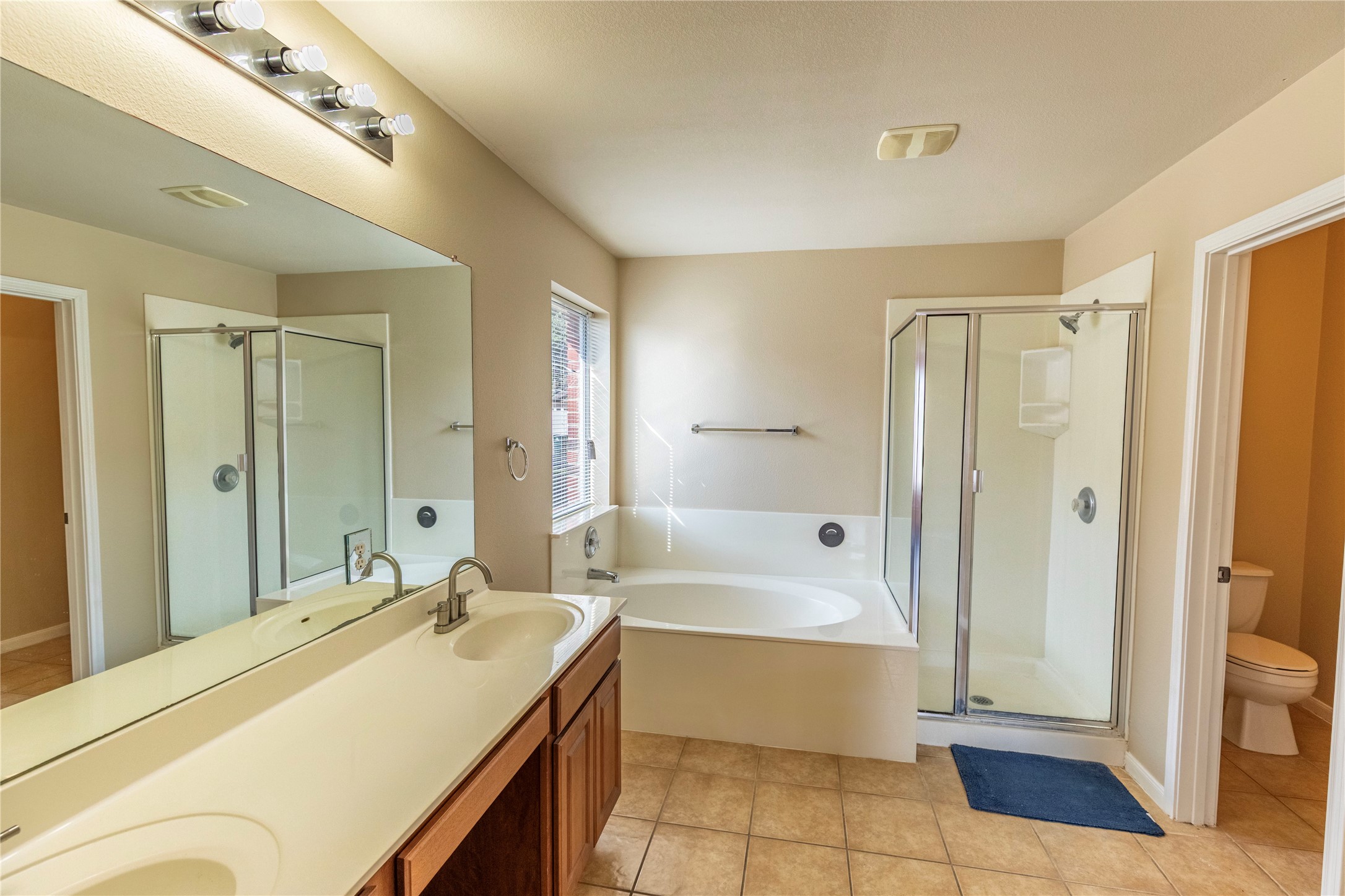102 Thompson Trail Bastrop, TX 78602 - Photo 13 of 18 a bathroom with a tub shower and sink