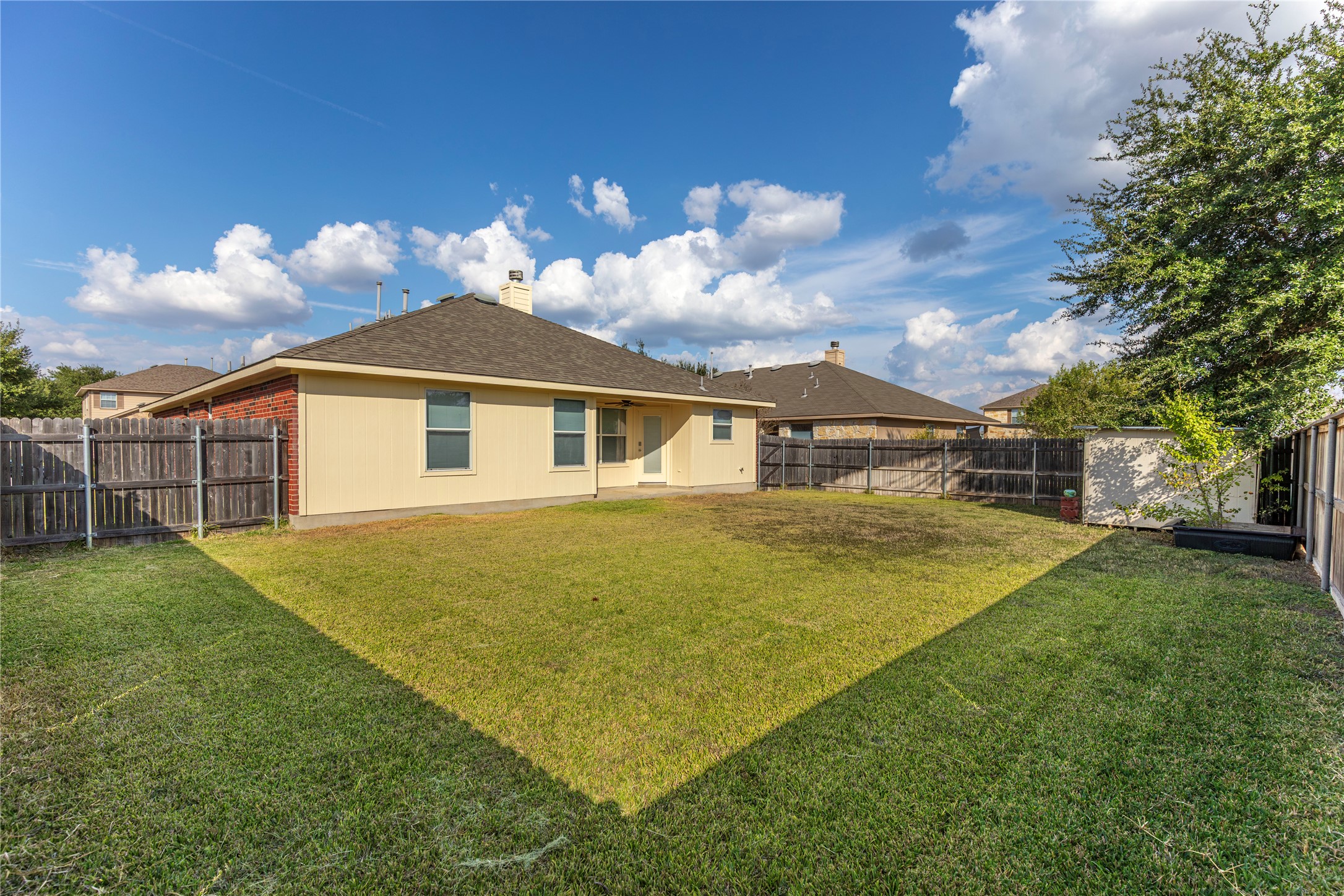 102 Thompson Trail Bastrop, TX 78602 - Photo 14 of 18 a view of a house with a backyard