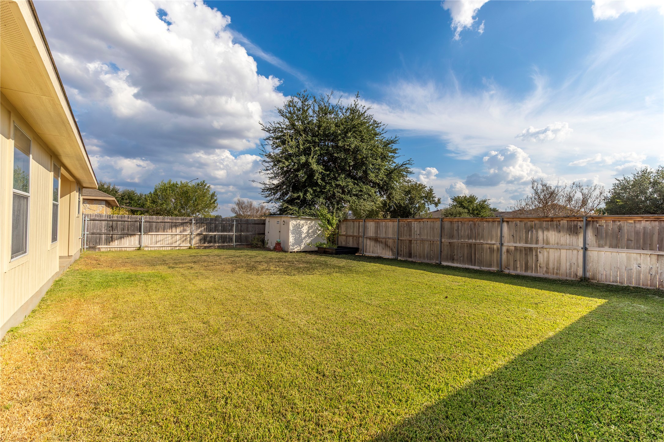 102 Thompson Trail Bastrop, TX 78602 - Photo 15 of 18 a view of a swimming pool with an outdoor space and seating area