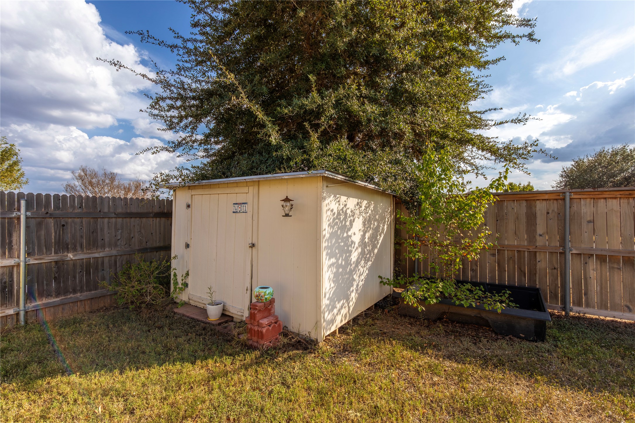 102 Thompson Trail Bastrop, TX 78602 - Photo 16 of 18 a view of a backyard