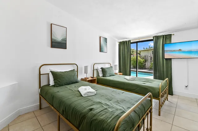 a bedroom with a bed and window