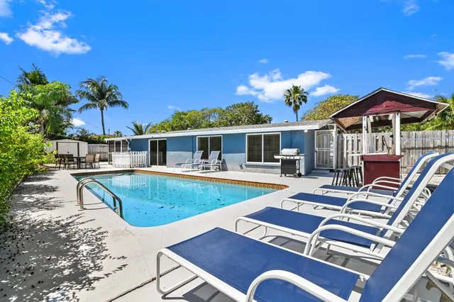 a view of a patio with swimming pool