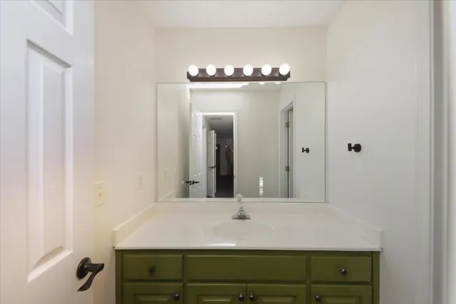 a white bath tub sitting next to a white toilet and a shower
