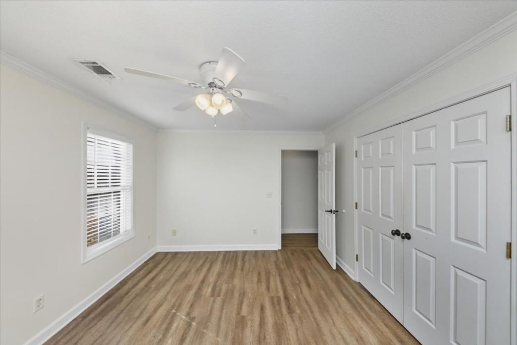 2515 Lakeview Trail Cumming, GA 30041 - Photo 16 of 27 wooden floor in an empty room with a window