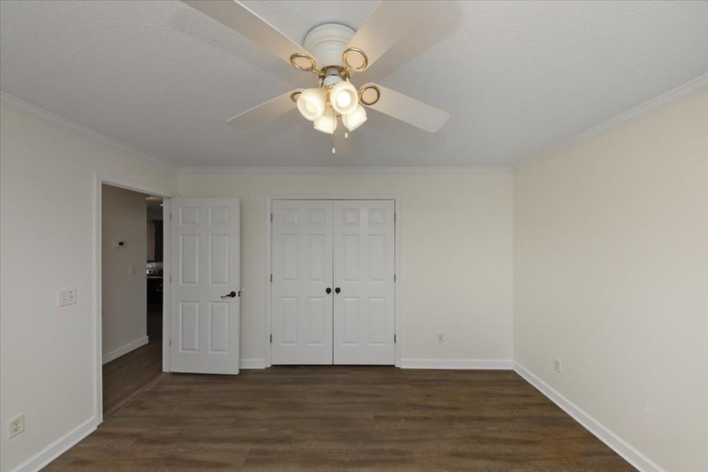 2515 Lakeview Trail Cumming, GA 30041 - Photo 18 of 27 a view of an empty room with wooden floor