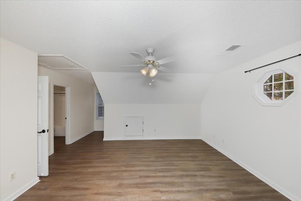 2515 Lakeview Trail Cumming, GA 30041 - Photo 19 of 27 an empty room with wooden floor and ceiling fan