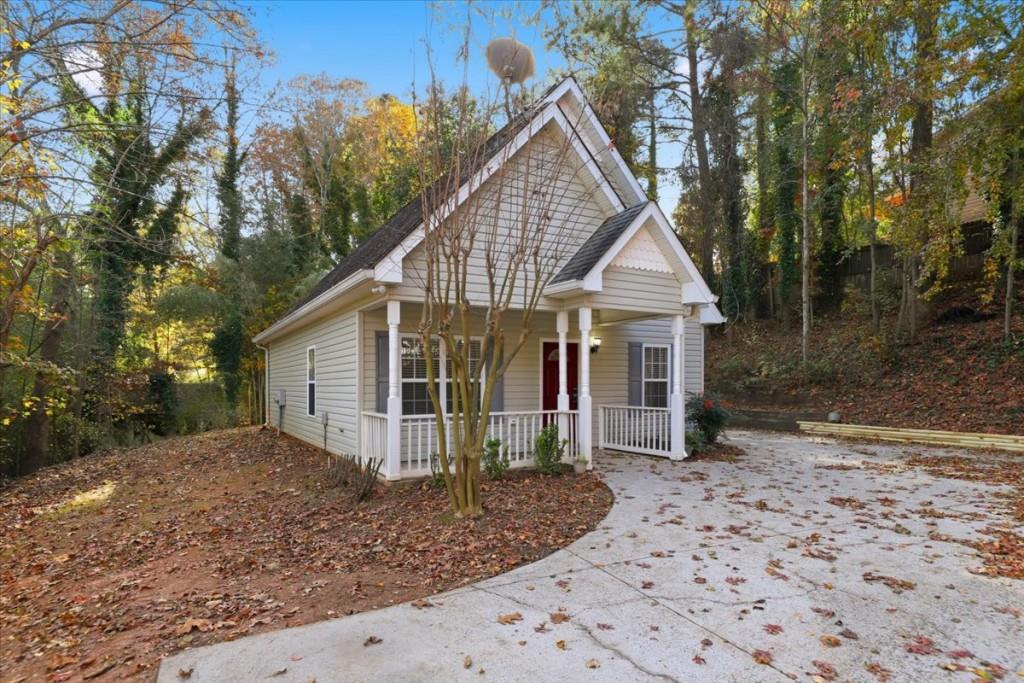 2515 Lakeview Trail Cumming, GA 30041 - Photo 3 of 27 a front view of a house with garden