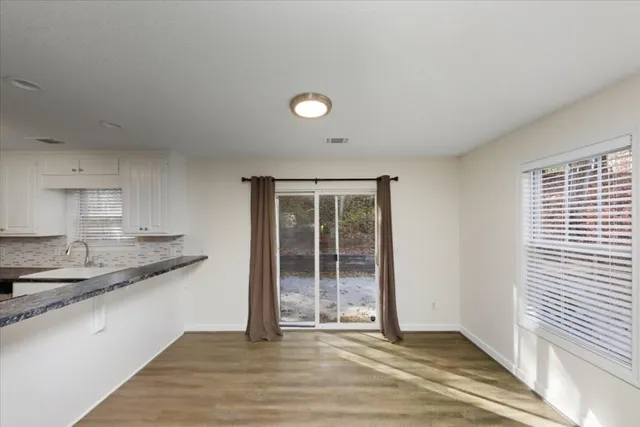 a view of a kitchen with a sink and dishwasher