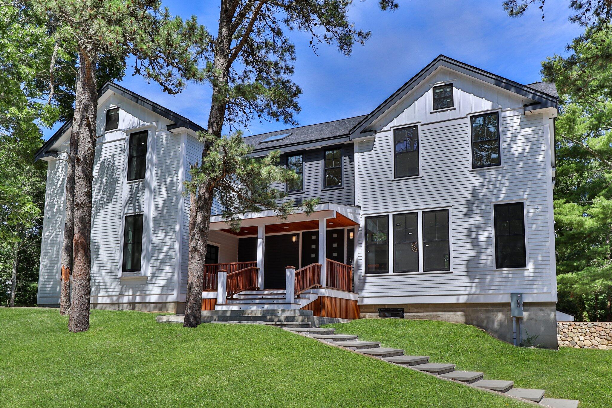 72 5 Corners Road Centerville, MA 02632 - Photo 1 of 48 a front view of a house with a yard