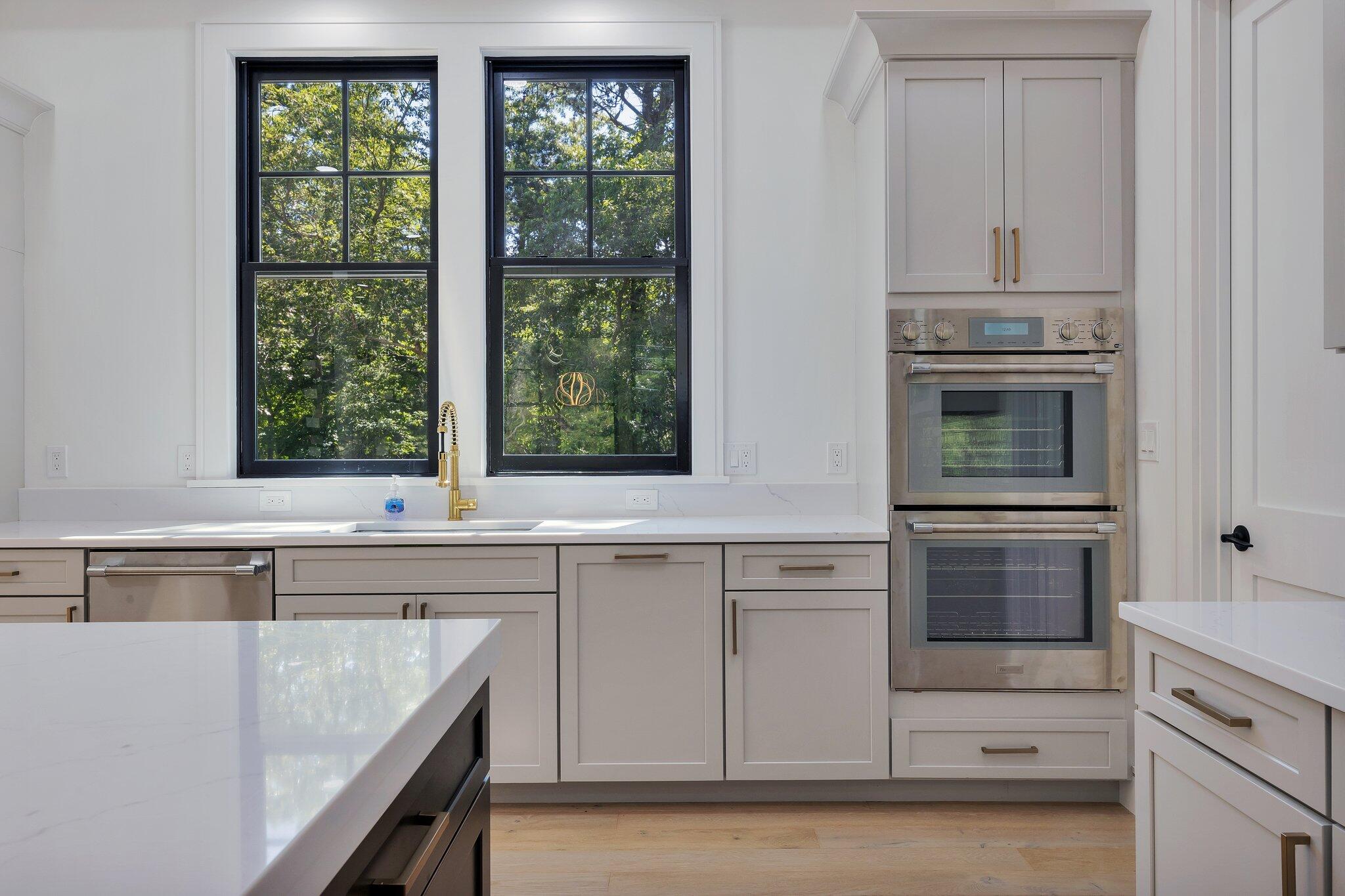 72 5 Corners Road Centerville, MA 02632 - Photo 11 of 48 a kitchen with cabinets appliances and a window