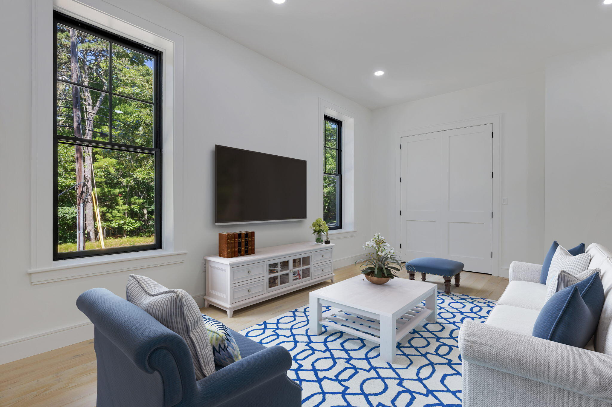 72 5 Corners Road Centerville, MA 02632 - Photo 17 of 48 a living room with furniture a flat screen tv and a window
