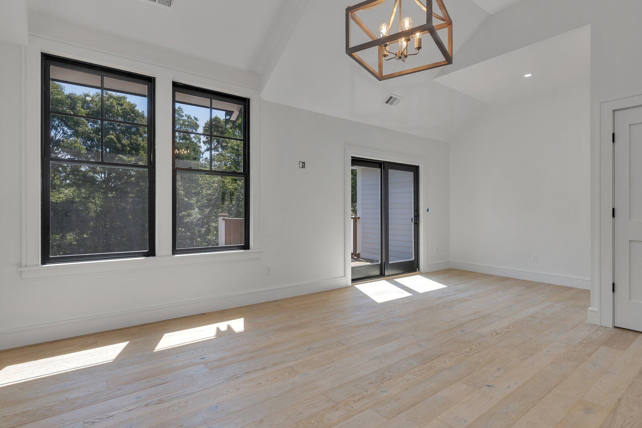 72 5 Corners Road Centerville, MA 02632 - Photo 27 of 48 a view of an empty room with a window and wooden floor