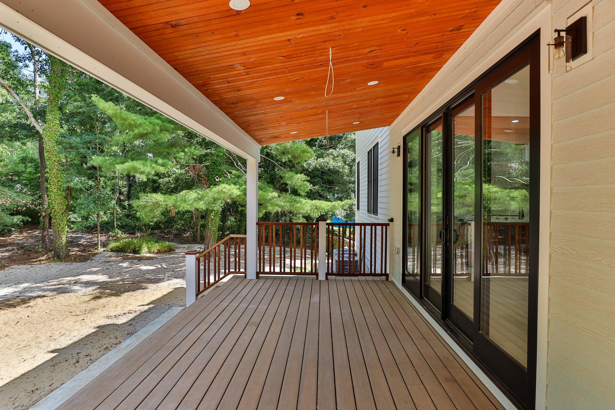 72 5 Corners Road Centerville, MA 02632 - Photo 36 of 48 a balcony with wooden floor