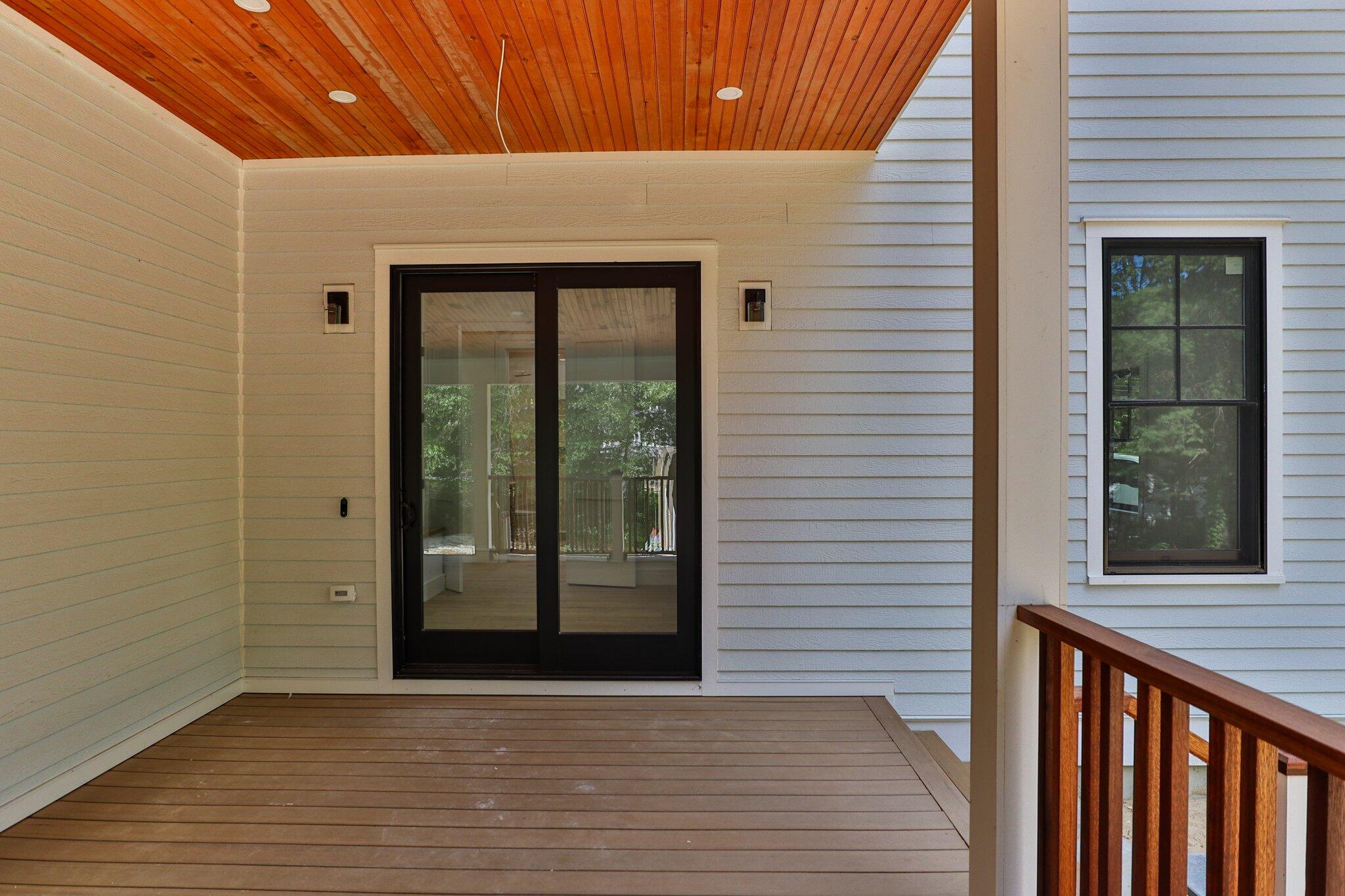 72 5 Corners Road Centerville, MA 02632 - Photo 37 of 48 a view of a porch with wooden floor and a table