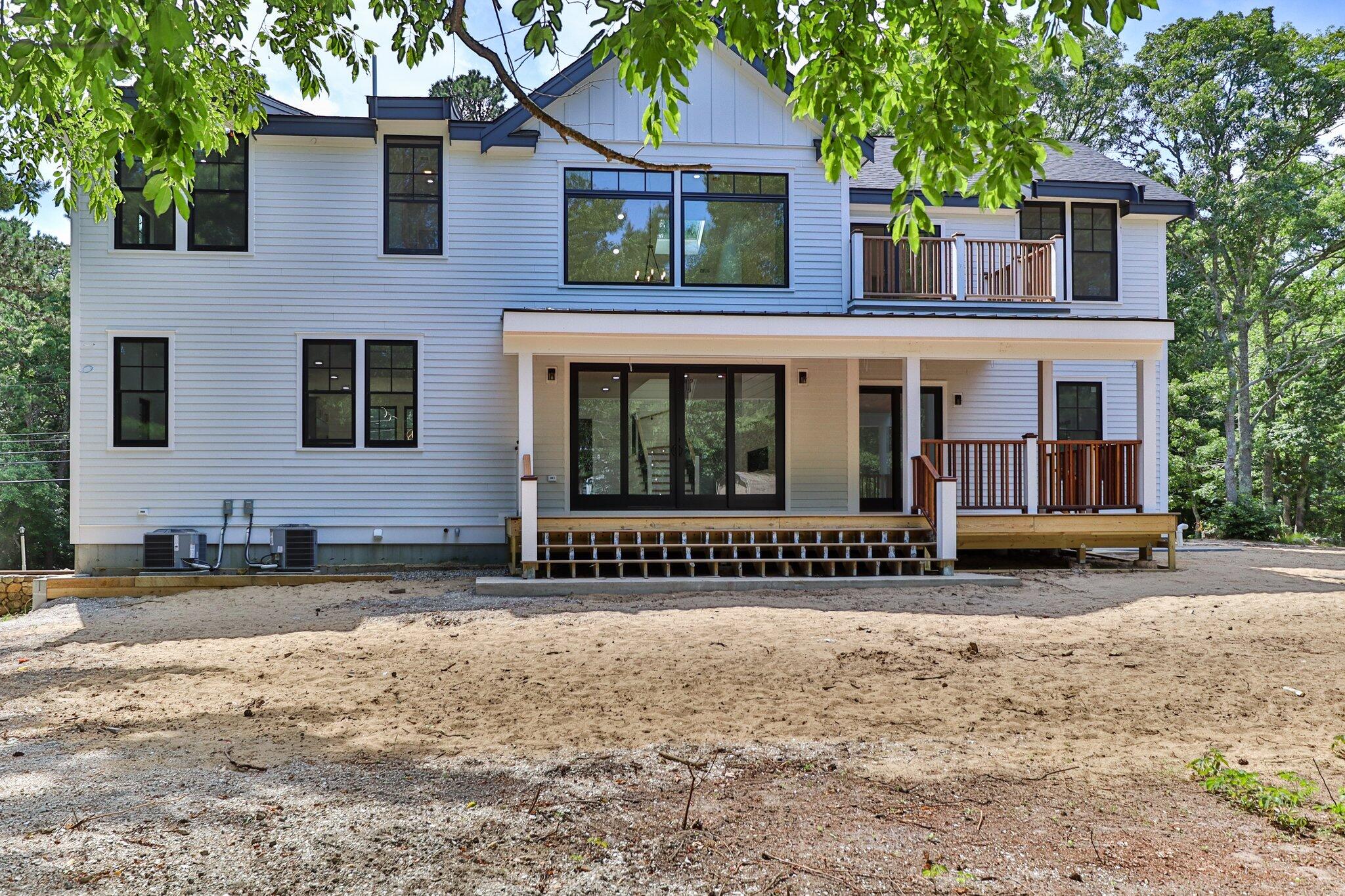 72 5 Corners Road Centerville, MA 02632 - Photo 40 of 48 a view of a house with a garden