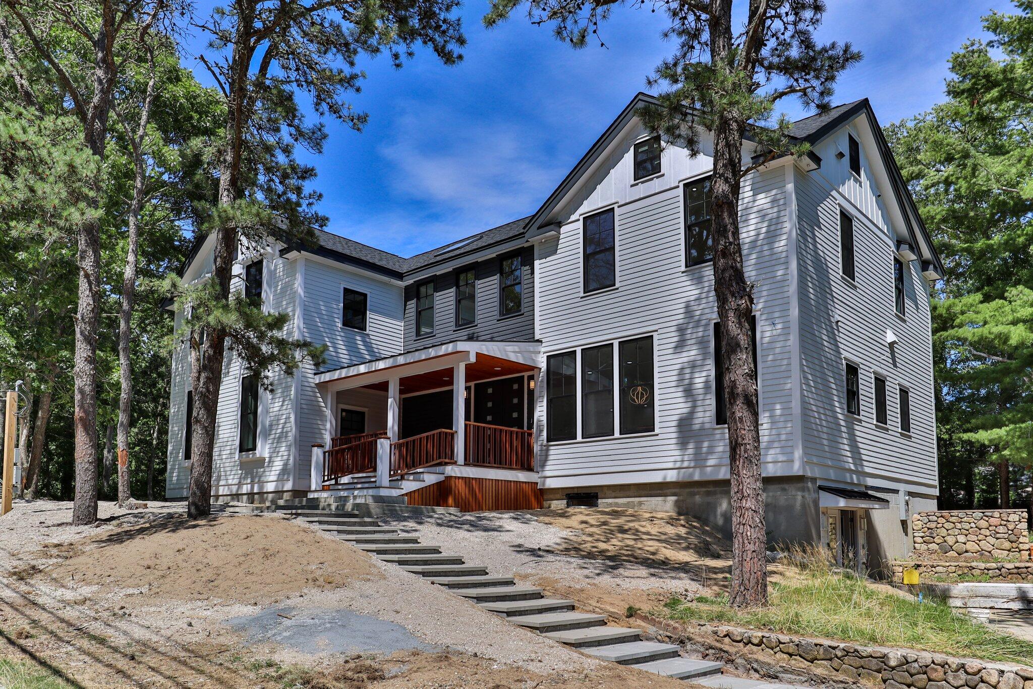 72 5 Corners Road Centerville, MA 02632 - Photo 42 of 48 a front view of a house with a yard