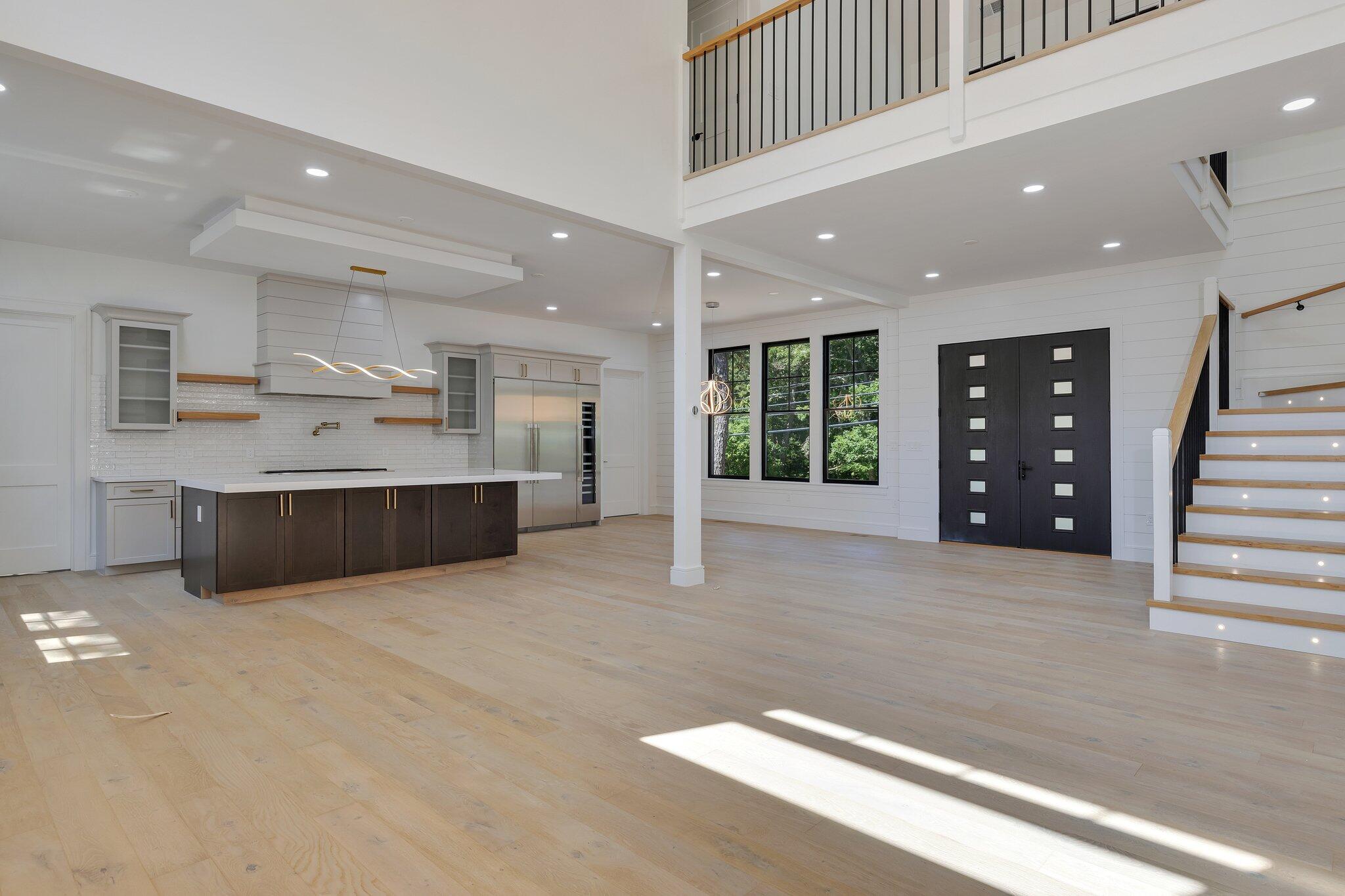 72 5 Corners Road Centerville, MA 02632 - Photo 6 of 48 a large room with kitchen island granite countertop a large window and a sink