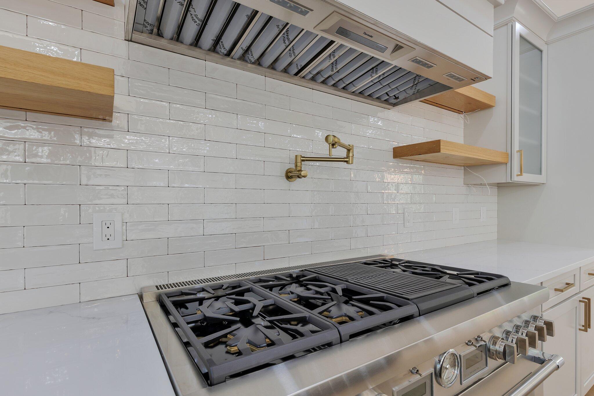 72 5 Corners Road Centerville, MA 02632 - Photo 9 of 48 a stove top oven sitting inside of a kitchen