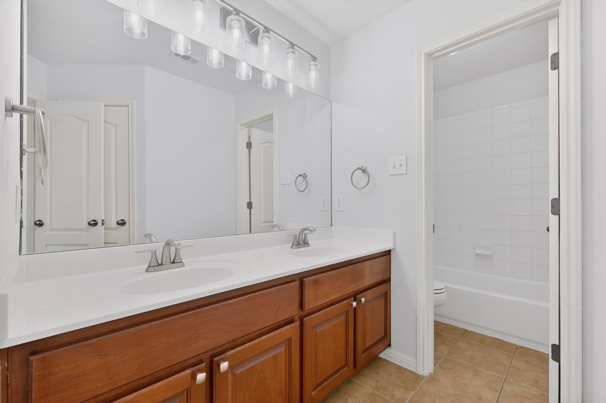 8617 Cobblestone Austin, TX 78735 - Photo 32 of 39 a bathroom with a sink double vanity granite tub and shower