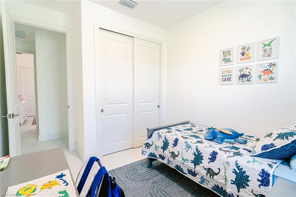 907 Homestead Road South Lehigh Acres, FL 33974 - Photo 21 of 43 Recessed lighting illuminating the room with neutral wall finishes