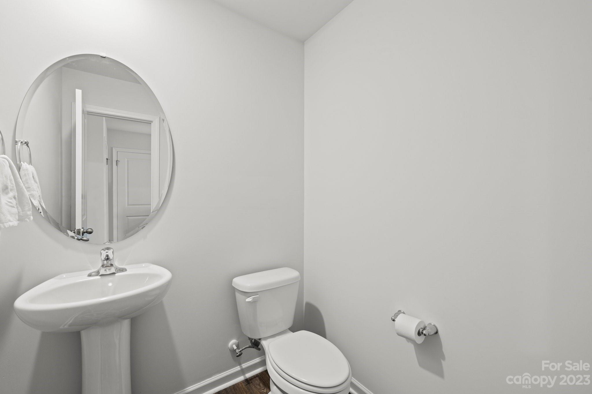 38 Hamrick Drive Candler, NC 28715 - Photo 16 of 37 a bathroom with a toilet sink and mirror