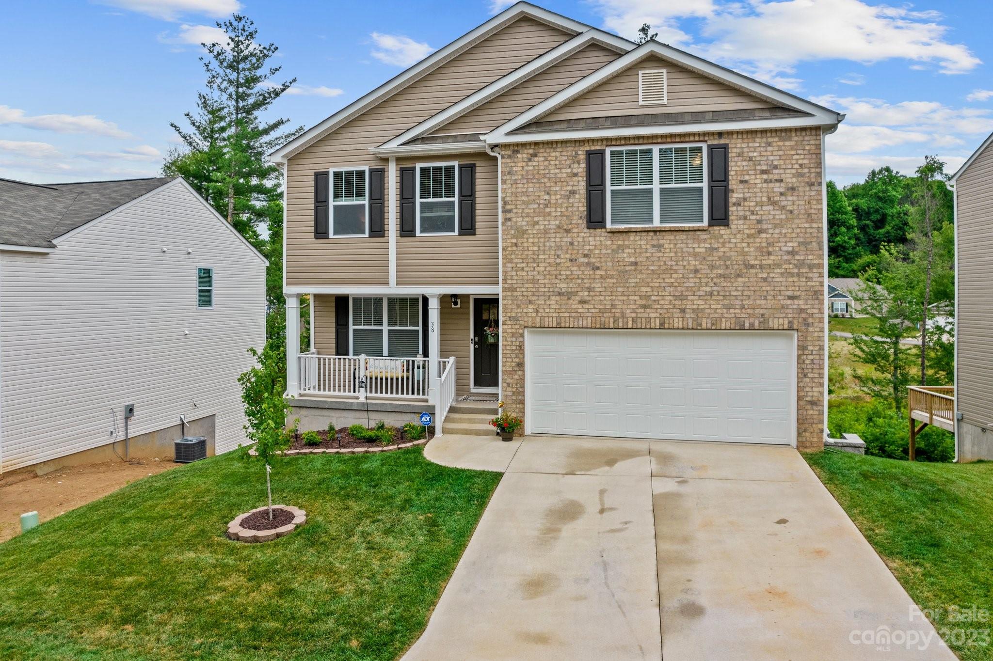 38 Hamrick Drive Candler, NC 28715 - Photo 2 of 37 a front view of a house with a yard