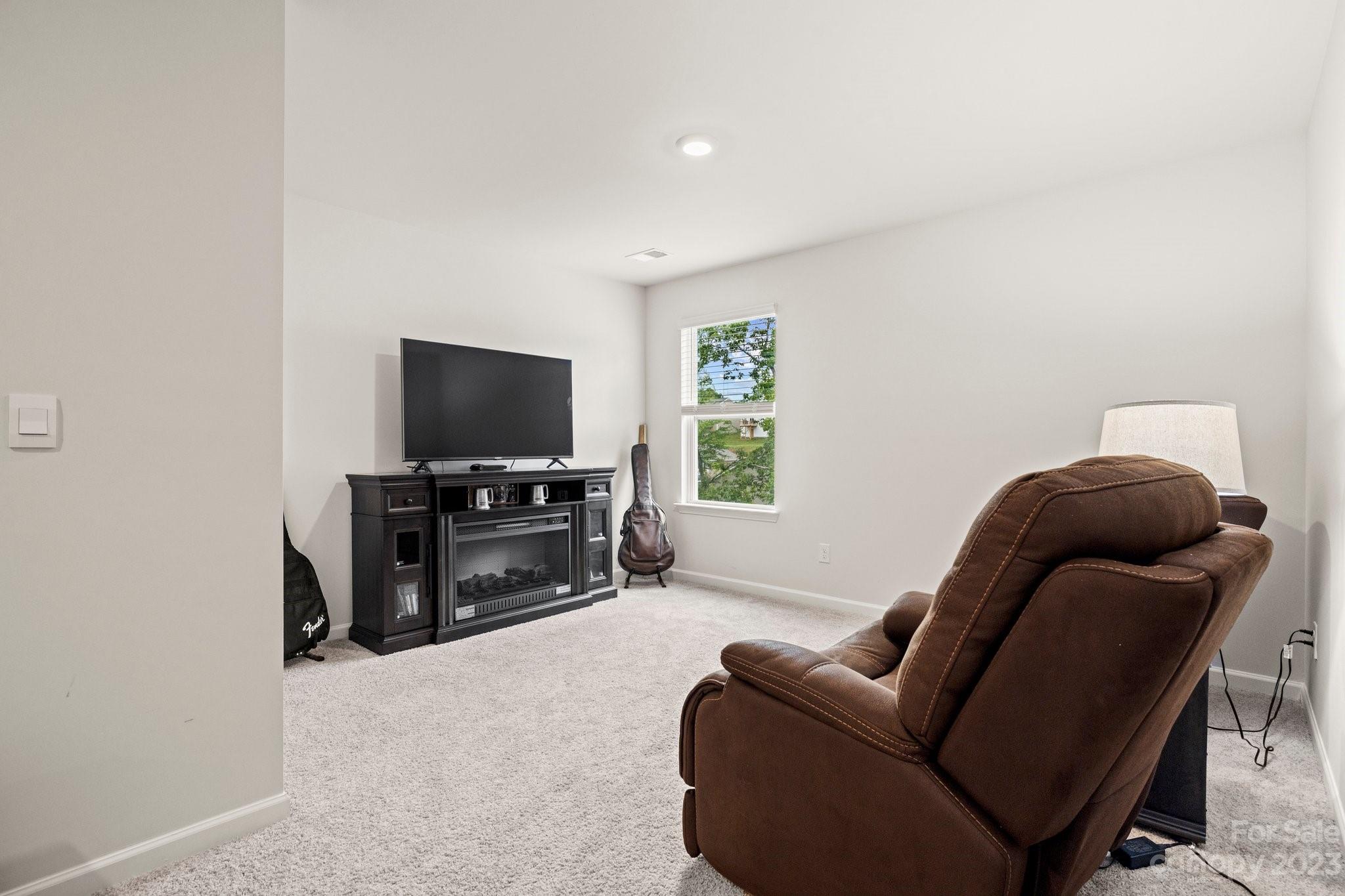 38 Hamrick Drive Candler, NC 28715 - Photo 21 of 37 a living room with furniture and a flat screen tv