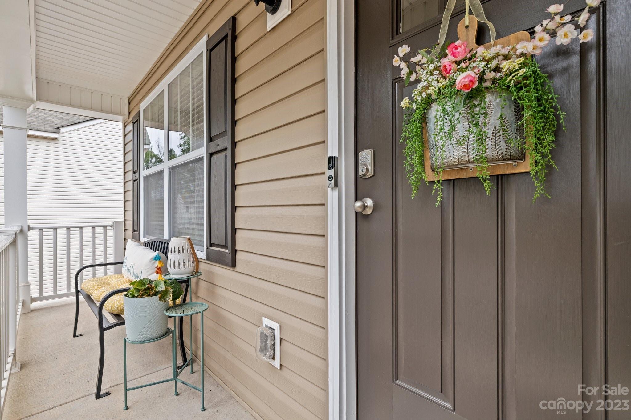 38 Hamrick Drive Candler, NC 28715 - Photo 3 of 37 a balcony with table and chairs and potted plants