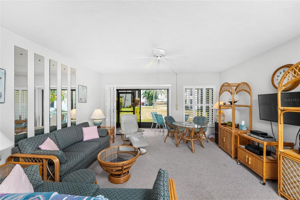 2955 North Beach Road, Unit B614 Englewood, FL 34223 - Photo 7 of 67 a living room with furniture and a large window