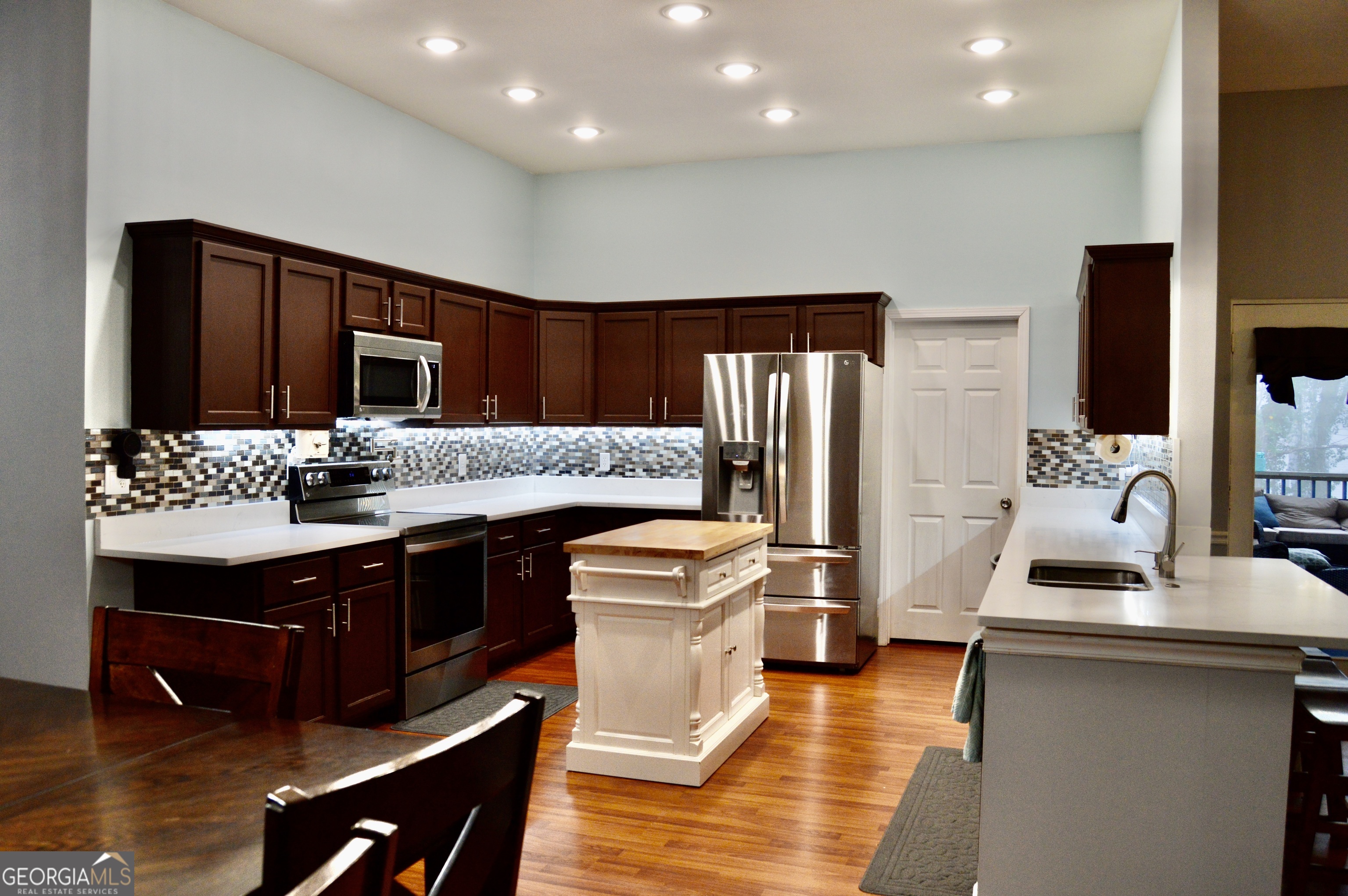 817 Brookside Drive Winder, GA 30680 - Photo 11 of 126 a kitchen with stainless steel appliances granite countertop a sink stove and refrigerator