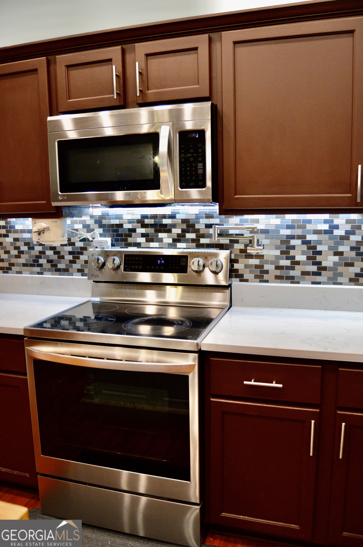 817 Brookside Drive Winder, GA 30680 - Photo 15 of 126 a stove top oven sitting inside of a kitchen