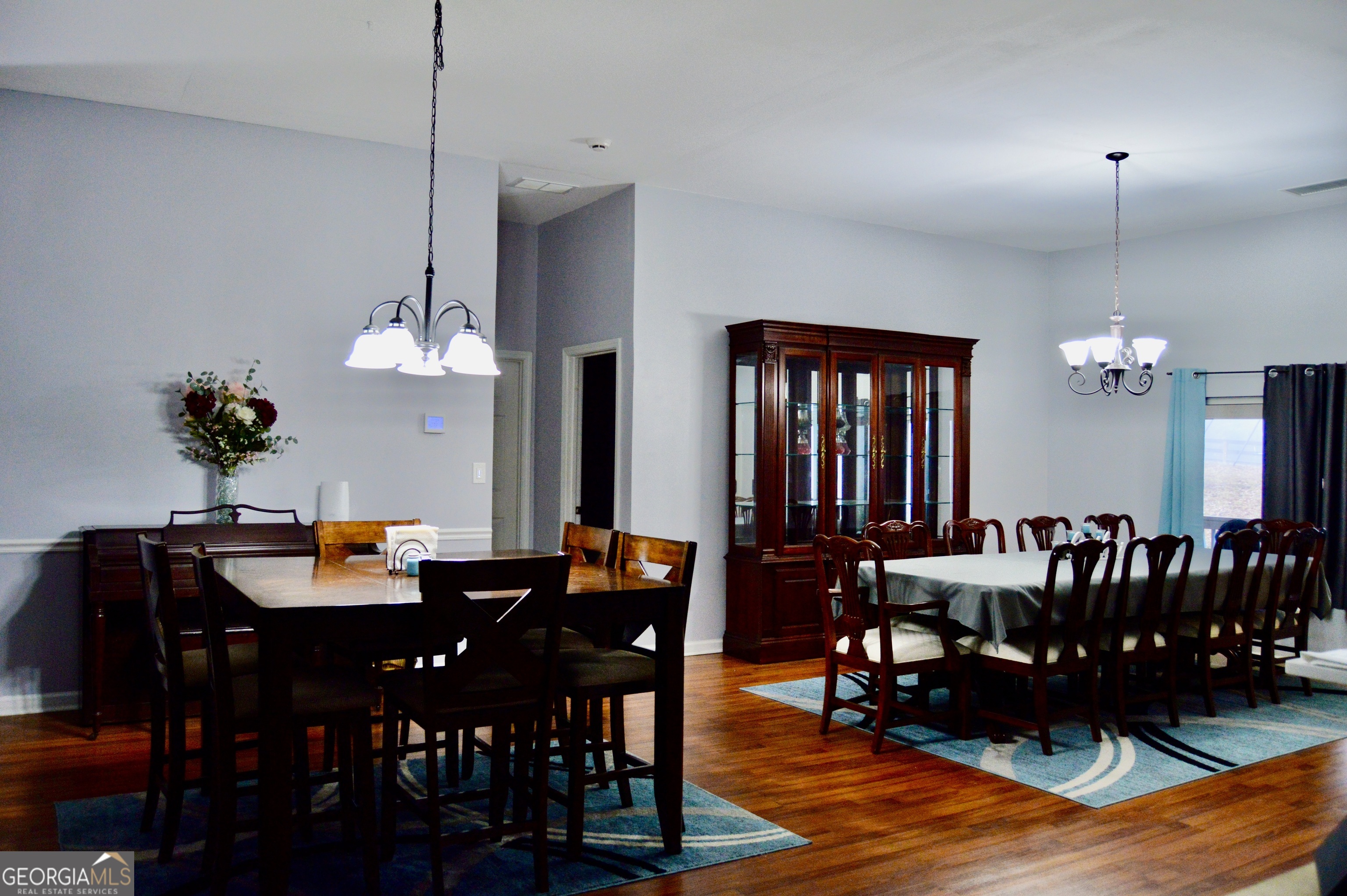 817 Brookside Drive Winder, GA 30680 - Photo 25 of 126 a view of a dining room with furniture and chandelier
