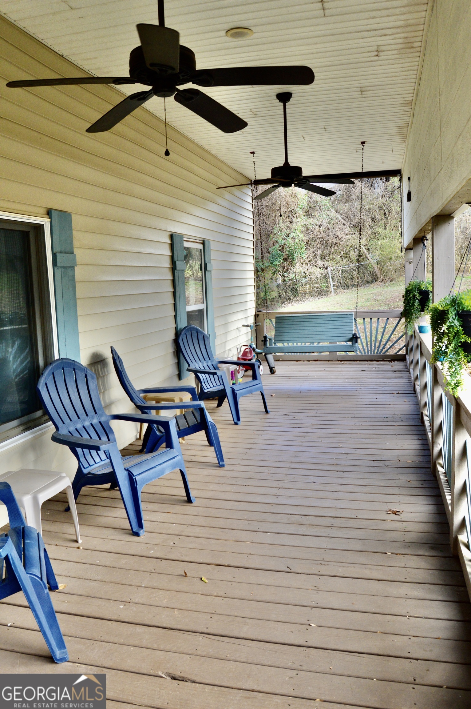 817 Brookside Drive Winder, GA 30680 - Photo 3 of 126 a view of a patio with table and chairs with wooden floor and fence