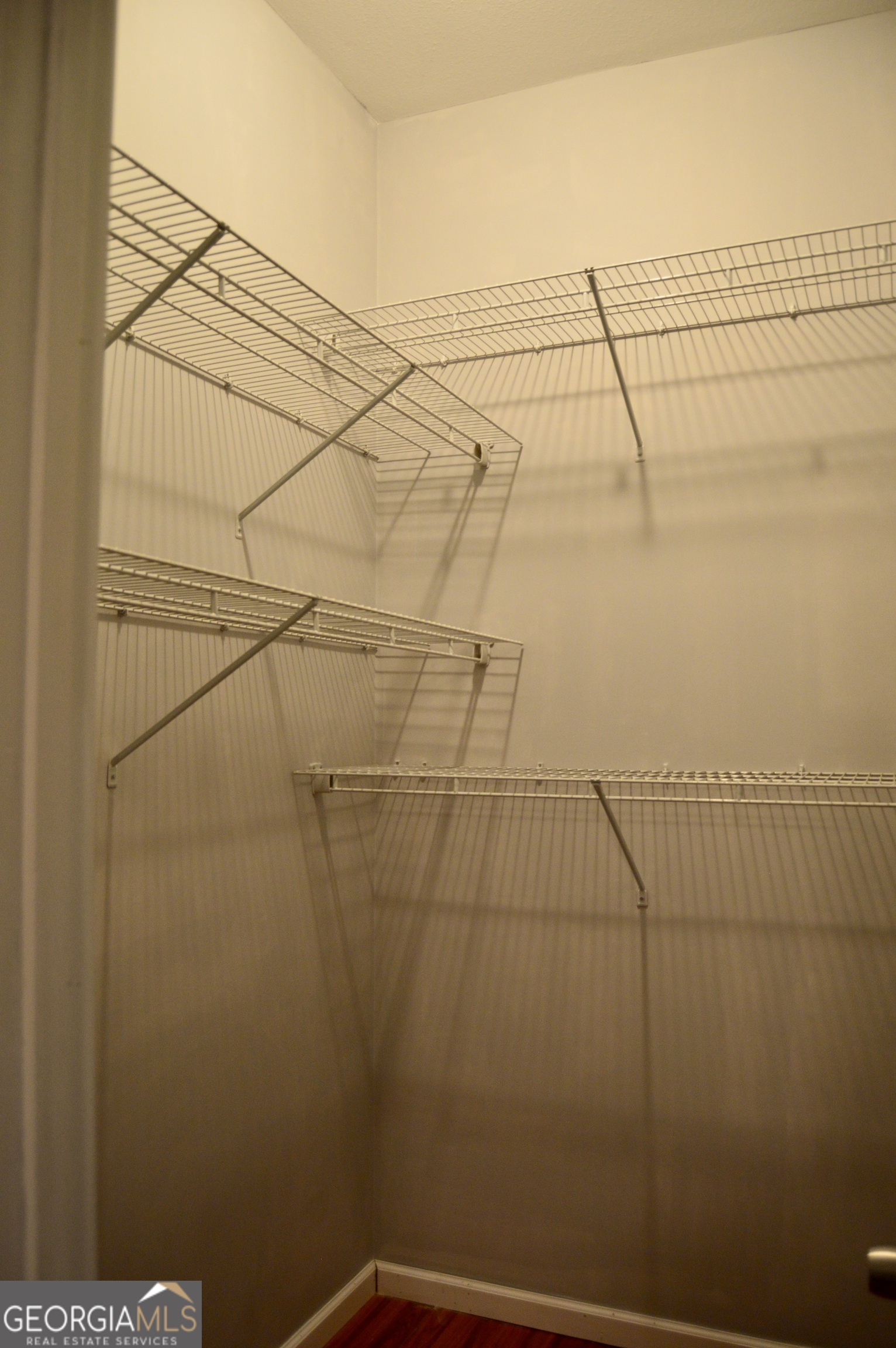 817 Brookside Drive Winder, GA 30680 - Photo 32 of 126 This is the walk in closet that is located in the second bedroom of the main floor.