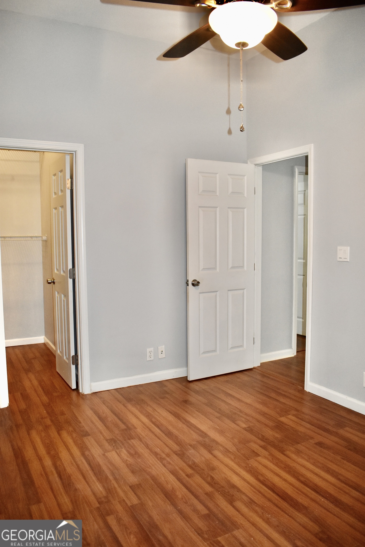 817 Brookside Drive Winder, GA 30680 - Photo 36 of 126 an empty room with wooden floor fan and windows