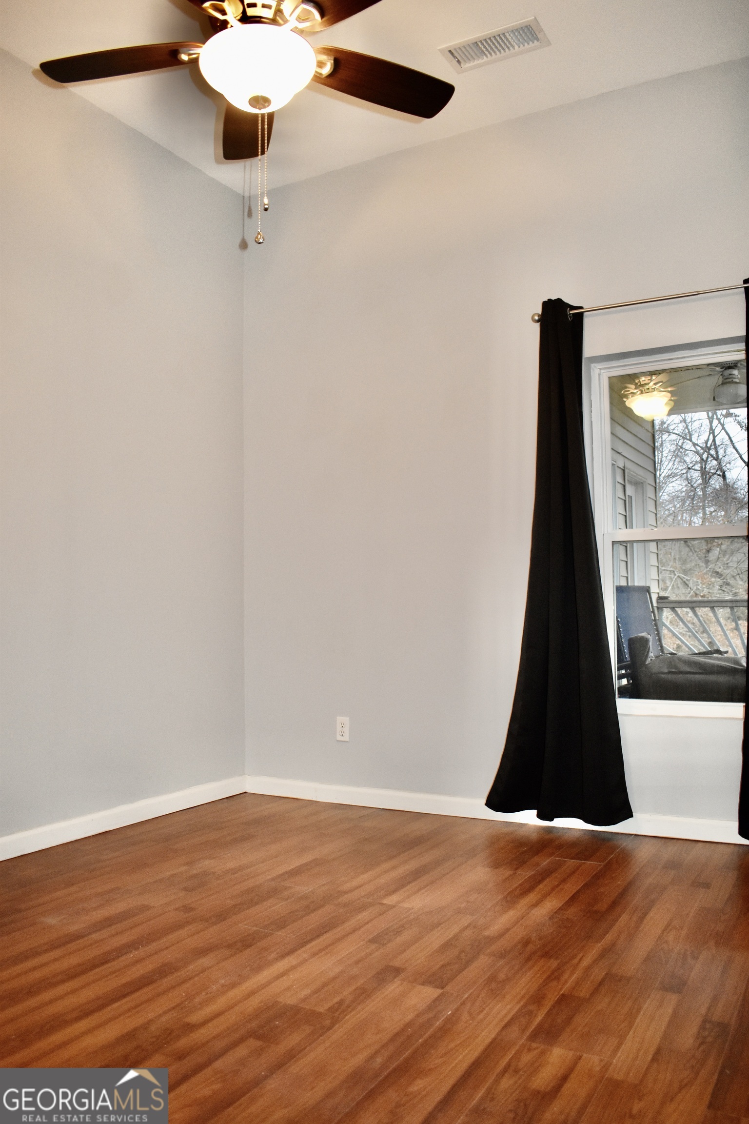 817 Brookside Drive Winder, GA 30680 - Photo 37 of 126 a view of a ceiling fan and a wooden floor