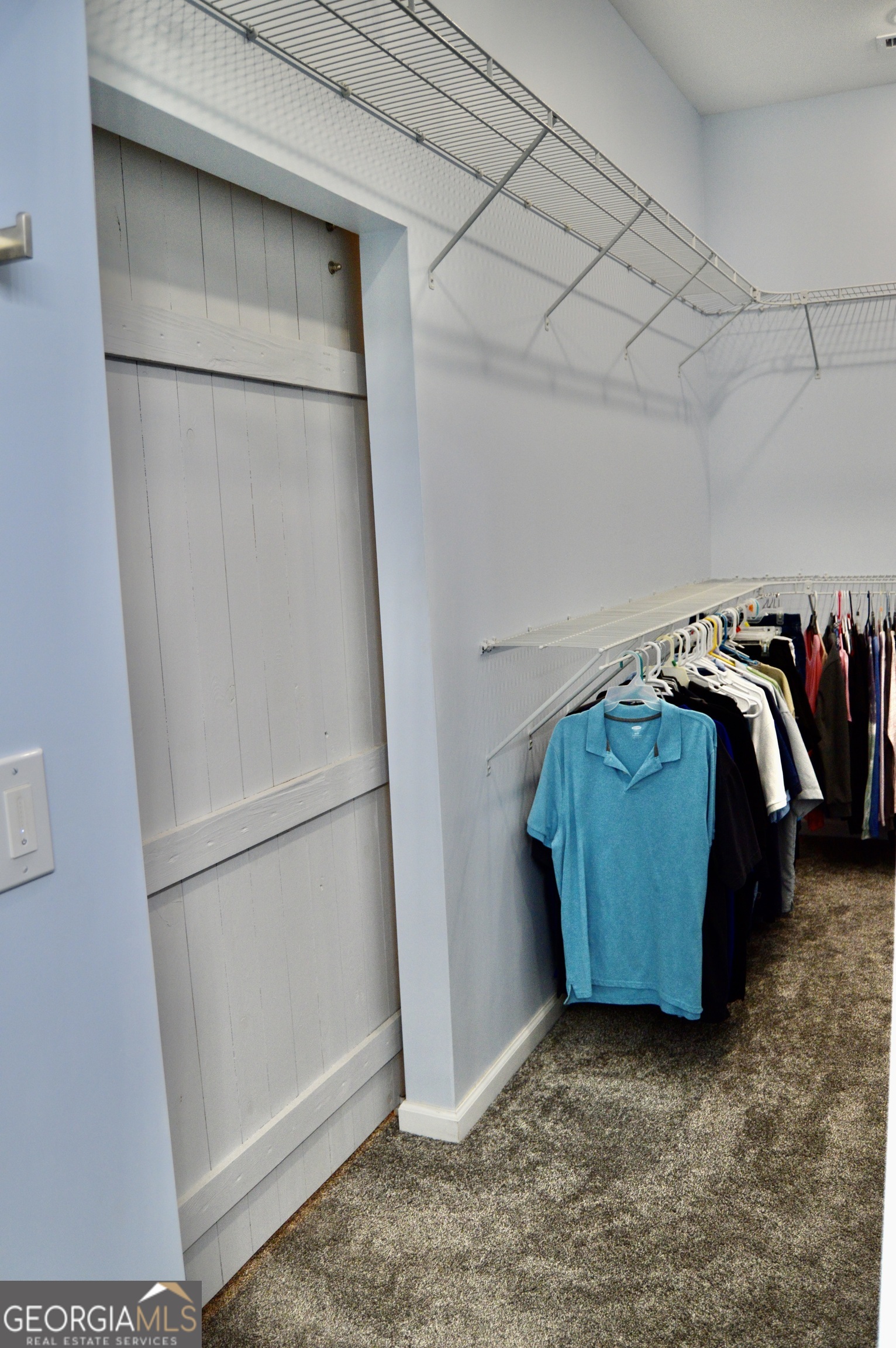 817 Brookside Drive Winder, GA 30680 - Photo 52 of 126 a view of walk in closet with clothes and shoes