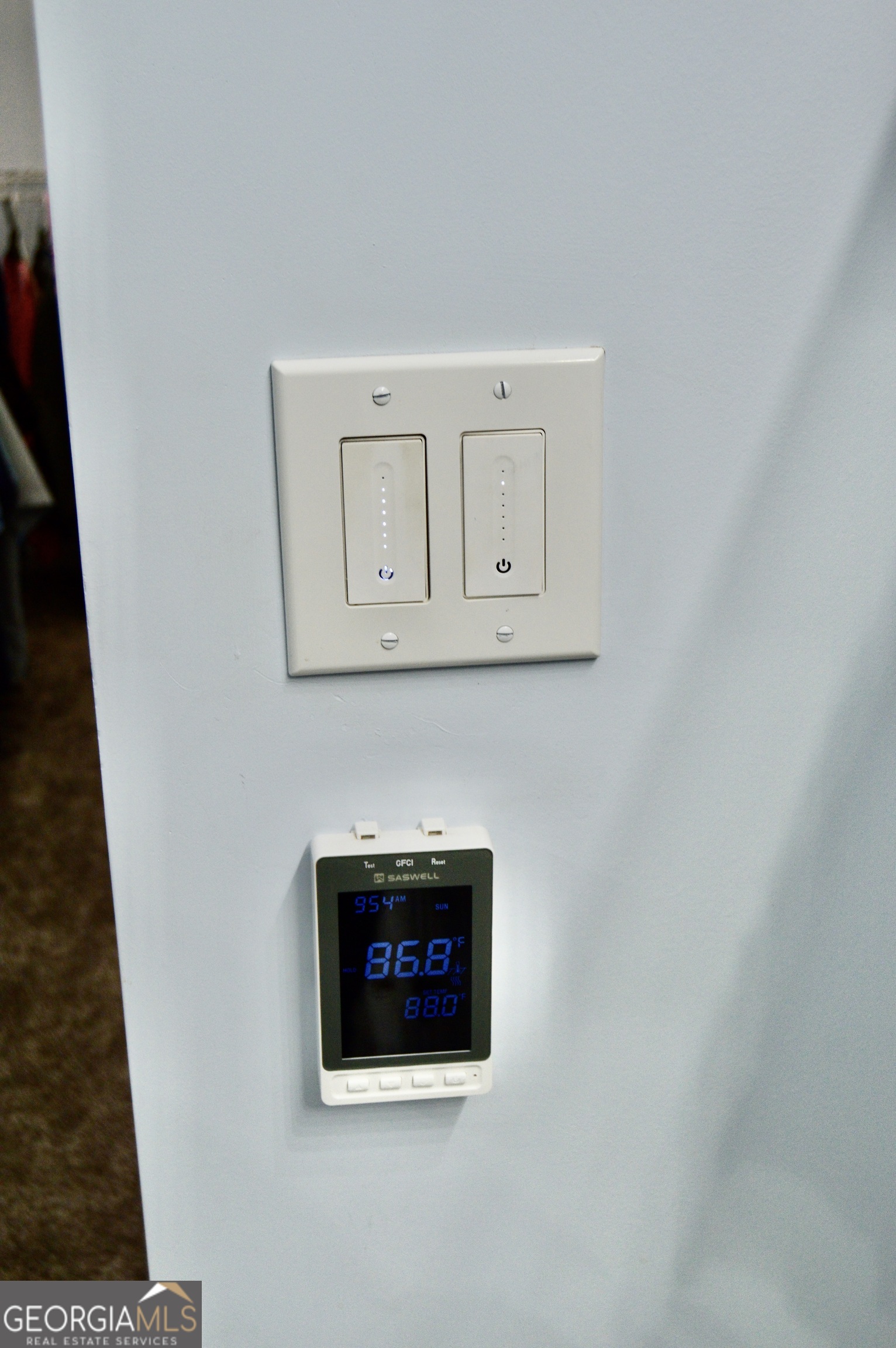 817 Brookside Drive Winder, GA 30680 - Photo 55 of 126 These are the controls for the lights and heated floors in the owners suite bathroom on the main floor.