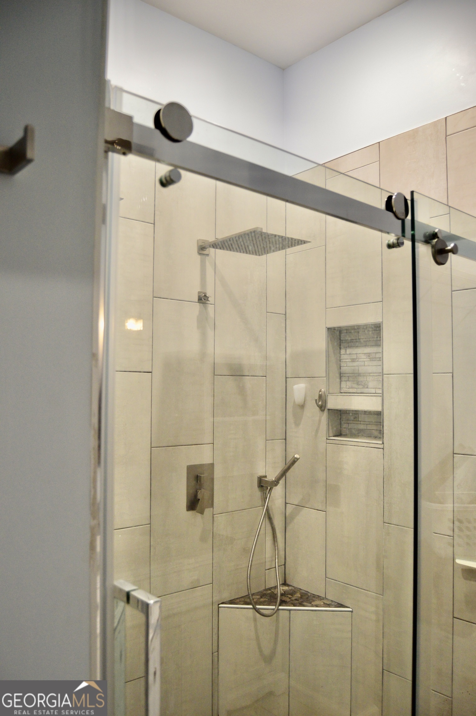 817 Brookside Drive Winder, GA 30680 - Photo 63 of 126 a bathroom with a glass shower door